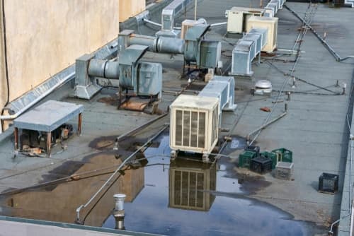 Water damage caused by a leaking roof in a home or business.
